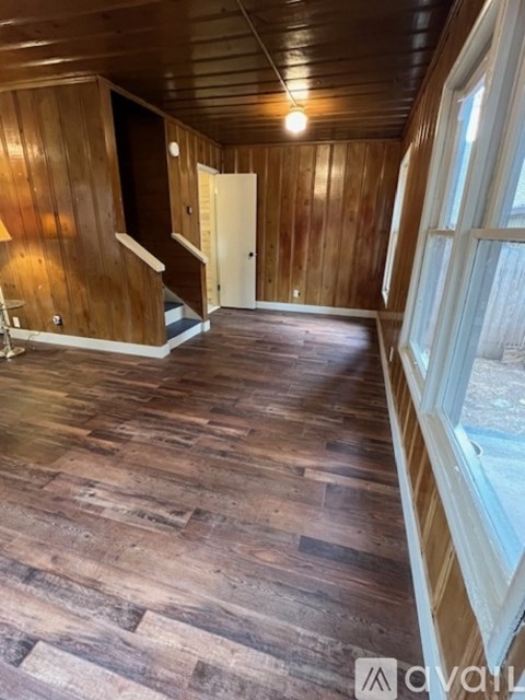 A room with wooden floors and walls.