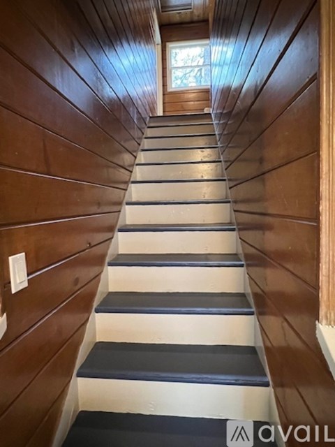 A long flight of stairs with alternating black and white steps.