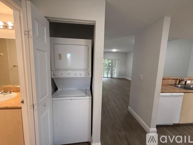 A small kitchen with a white oven and a sink.