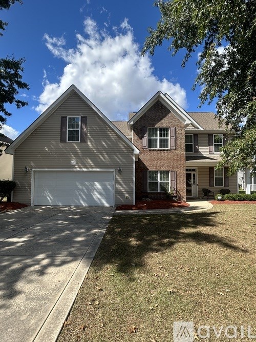 A house with a garage and a driveway.