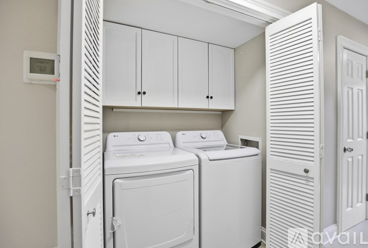 A laundry room with a washer and dryer.