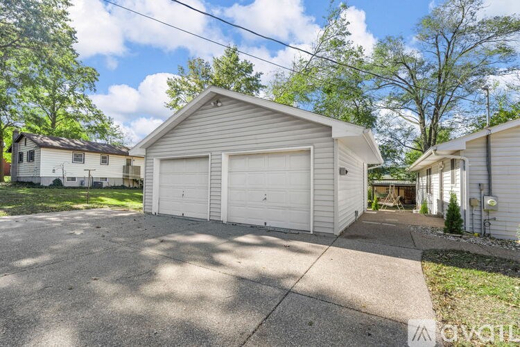 A two-car garage is located in a residential area.