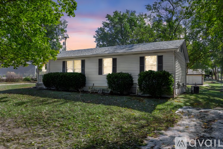 A house with a lawn in front of it.