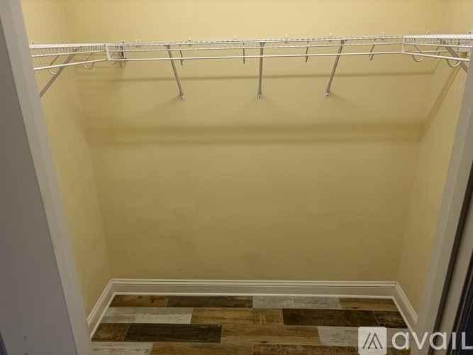 A white metal rack is mounted on the wall.