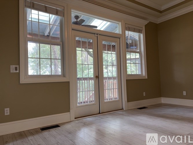 A room with a large door and a window.