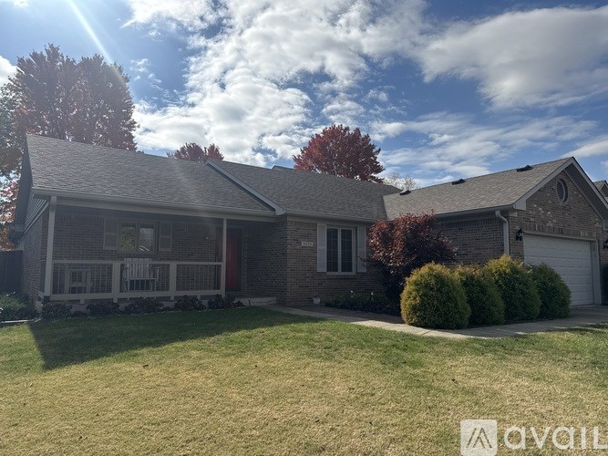 A house with a red door and a white porch.