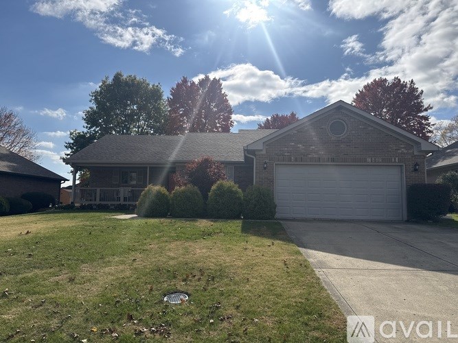 A house with a garage is for sale.