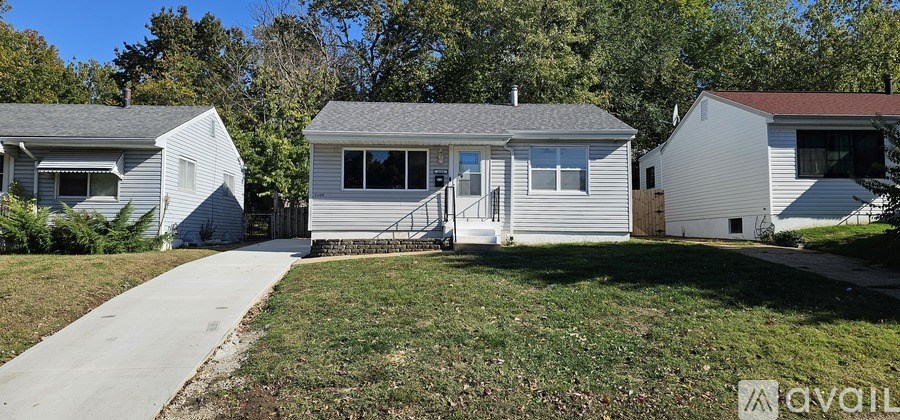 A row of houses with a walkway in front.