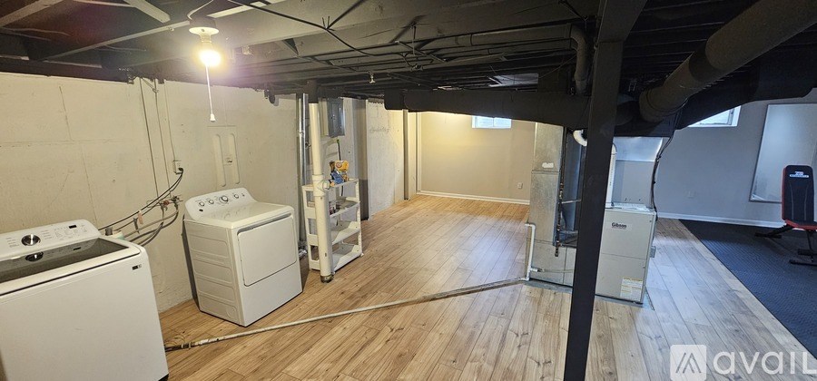 A room with a washer and dryer in it.