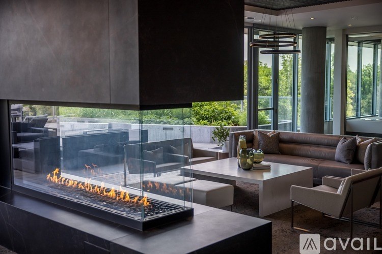 A modern living room with a fireplace and a couch.