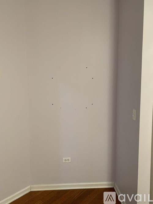 A room with a light switch on the wall.