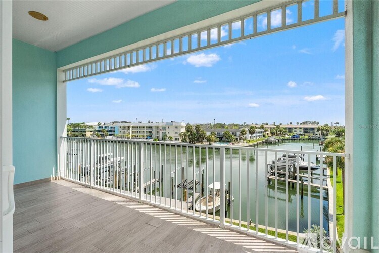 A balcony with a view of a marina and buildings.