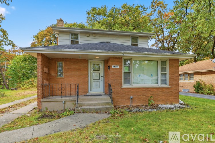 A small house with a brick facade and a white door is for sale.
