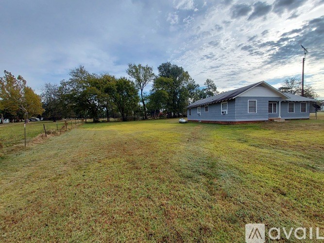 A house with a yard in front of it.