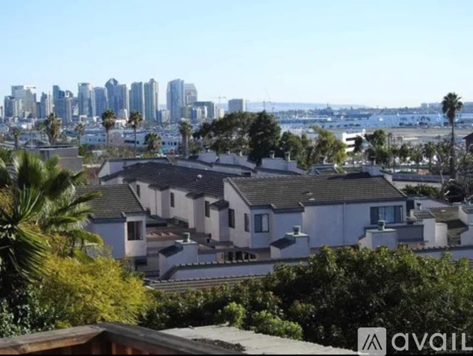 A house with a view of a city skyline is for sale.