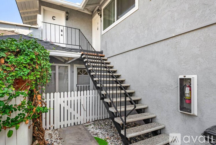 A house with a staircase leading to the second floor.
