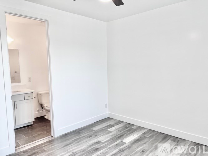 A white bathroom with a toilet and a sink.