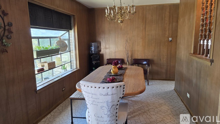 A bathroom with a toilet, sink, and shower.