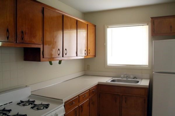 a kitchen with a stove and a sink