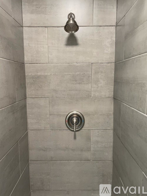 A shower head mounted on a wall.