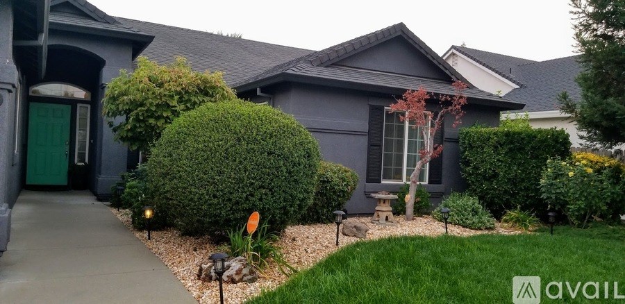 A house with a green door and a sign that says "available".