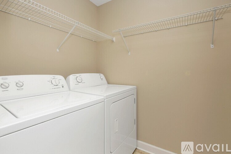 A laundry room with a washer and dryer.