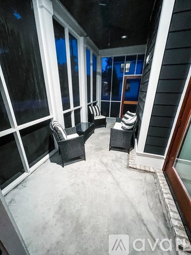 A patio with a table and chairs.