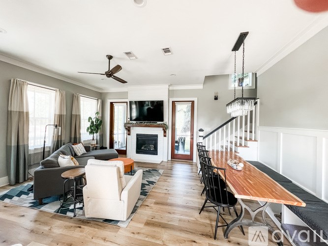 A living room with a fireplace and a television.