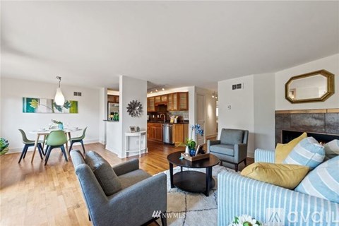 A living room with a grey couch and a coffee table.