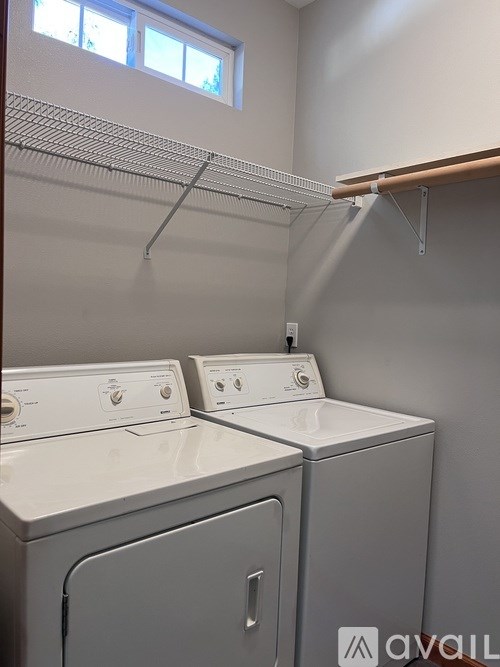 Two washing machines in a laundry room.