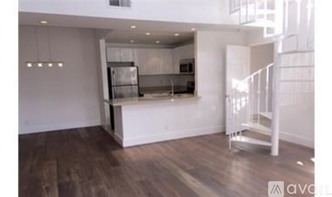 A kitchen with a refrigerator, stove, and oven is available for rent.