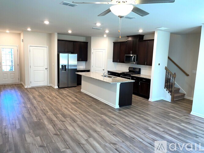 A spacious kitchen with a large island and modern appliances.