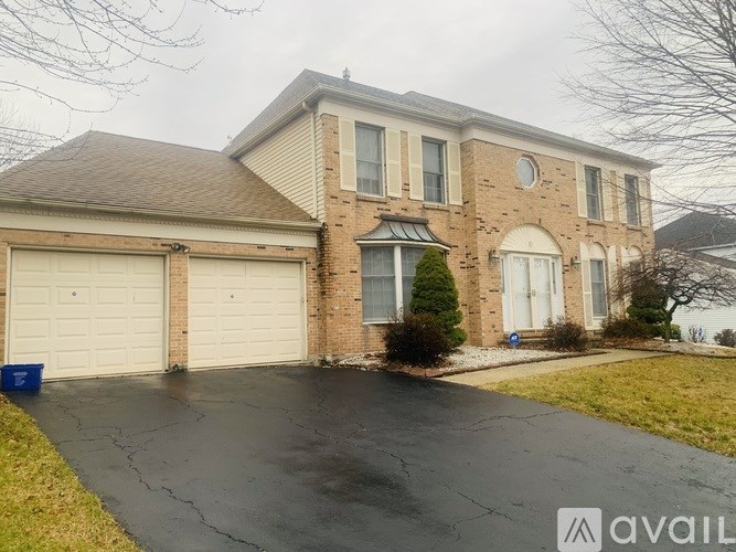 A house with a driveway in front of it.