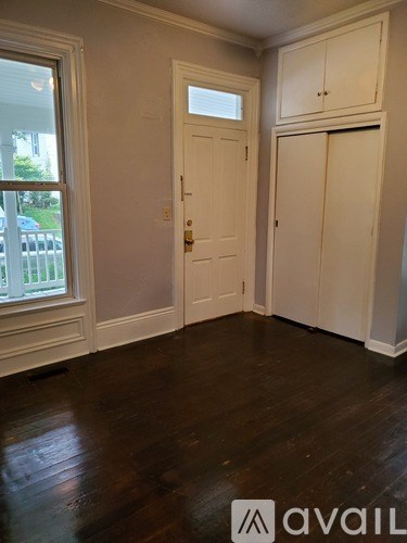 A room with a door and a window.