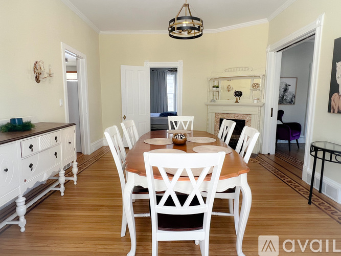 A kitchen with wooden cabinets and a white fridge.