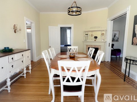A kitchen with wooden cabinets and a white fridge.