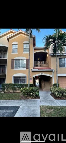 A building with a balcony and a doorway is shown.