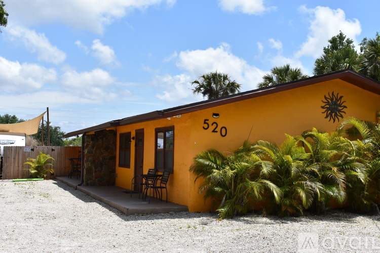 A yellow building with the number 520 on it.
