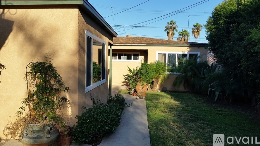 A house with a garden in front of it.