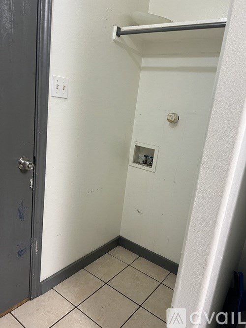 A small white bathroom with a toilet and a sink.