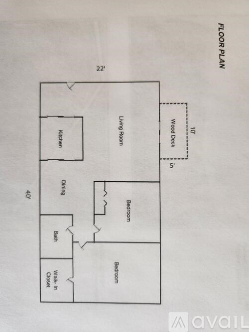 A floor plan of a house with a kitchen, dining room, living room, wood deck, and bathroom.