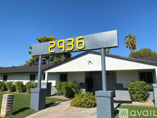 A house number sign with the number 2936 on it.