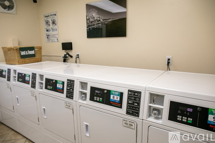 A row of washing machines in a laundromat.