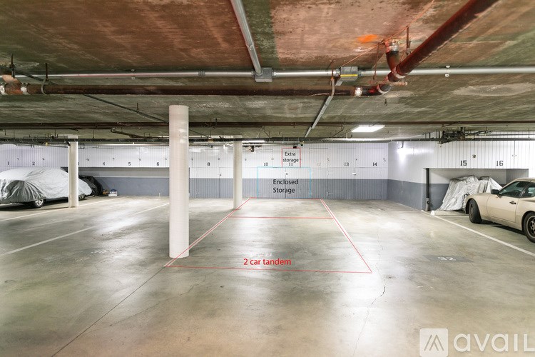 A spacious garage with a car parked on the right side and a sign indicating "2 car tandem" storage.