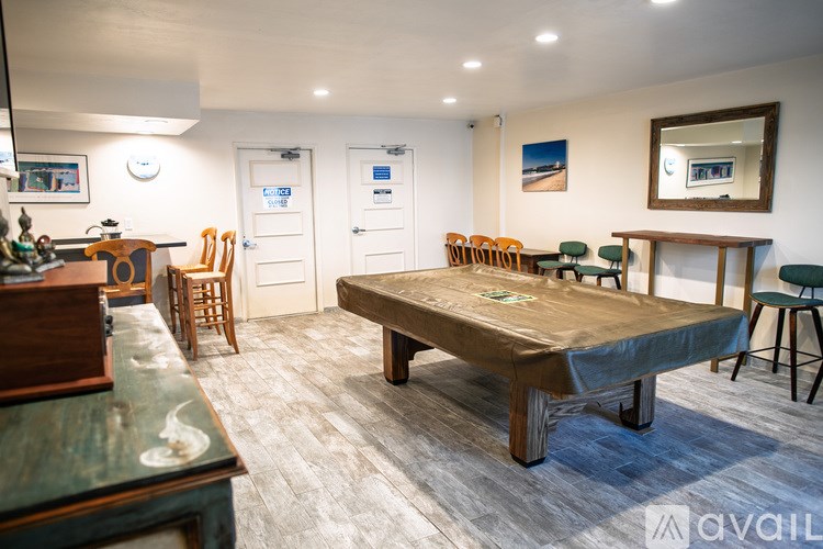 A room with a table and chairs in it.