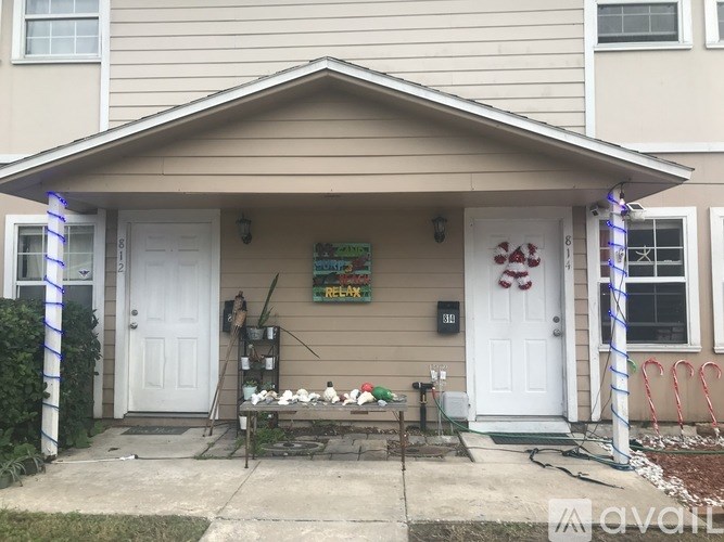 A house with a white door and a sign that says REMODEL.