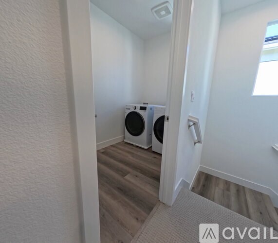 A laundry room with a washer and dryer.