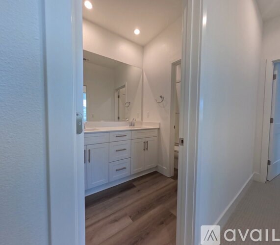 A bathroom with a vanity and a mirror.