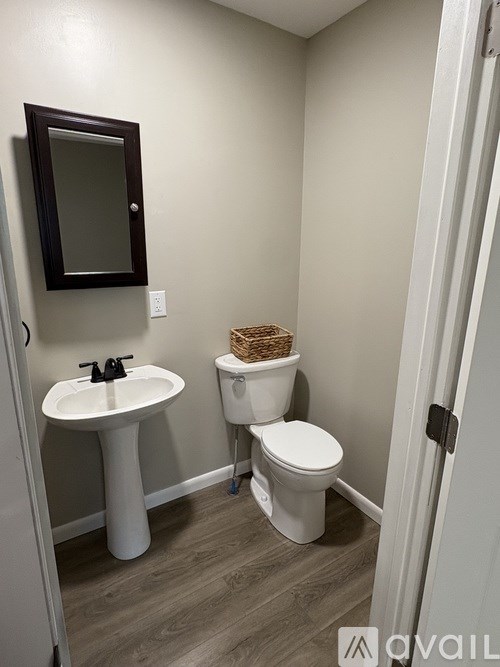 A bathroom with a white toilet and sink.
