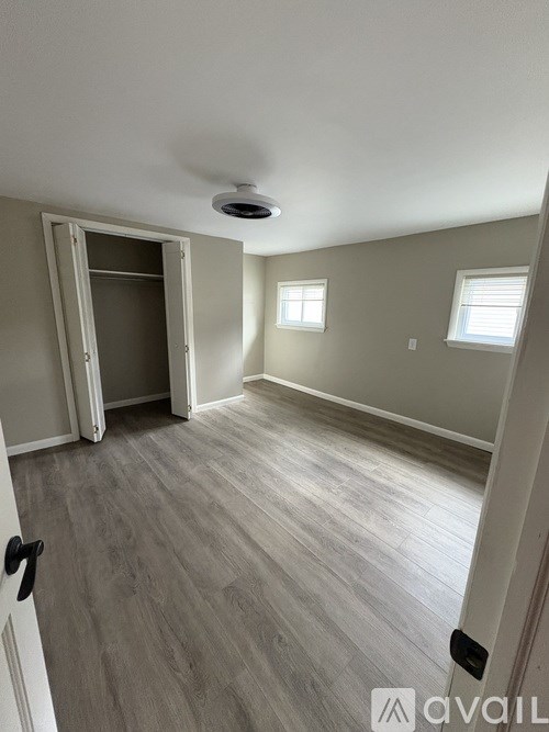 A room with a door and a window.